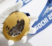 A gold medal manufactured for the 2014 Winter Olympic Games in Sochi, is seen on display at the Adamas jewellery factory in Moscow