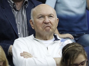 Moscow mayor Luzhkov reacts as he watches the play of compatriot Petrova against Spain's Navarro during their Fed Cup tennis match in Moscow