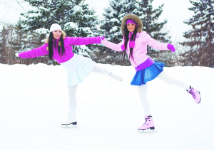 Two girls ice skating